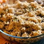 Mouthwatering pea pulao served hot in a transparent glass bowl, perfect for any meal.